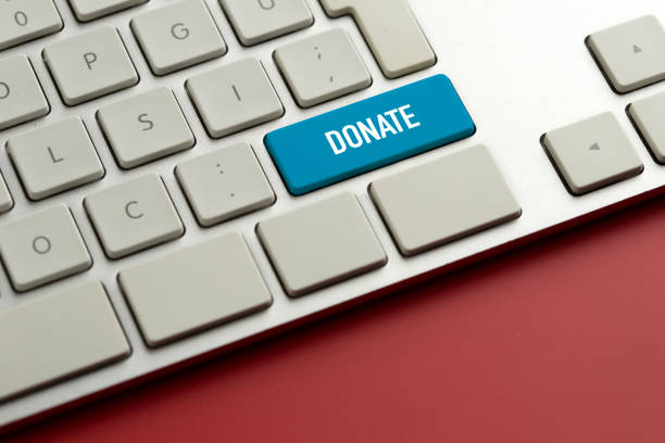 Computer key showing the word DONATE stock photo