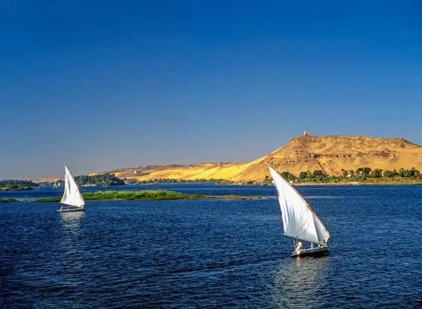 River Nile with feluccas in background monument  to  Aga Khan