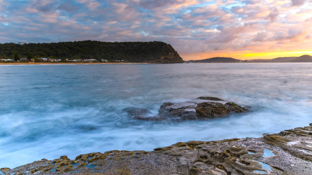 istock Sunrise Seascape with Clouds and Rock Platform 931134862
