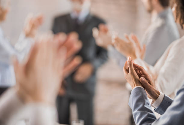 istock Group of unrecognizable business people applauding on a meeting. 931135794