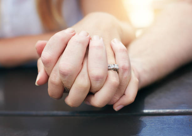 istock Male and female hands clasped 931136214