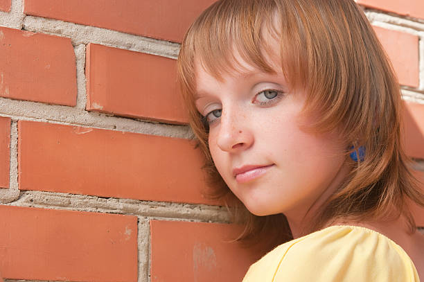 istock The girl at a brick wall 93113691