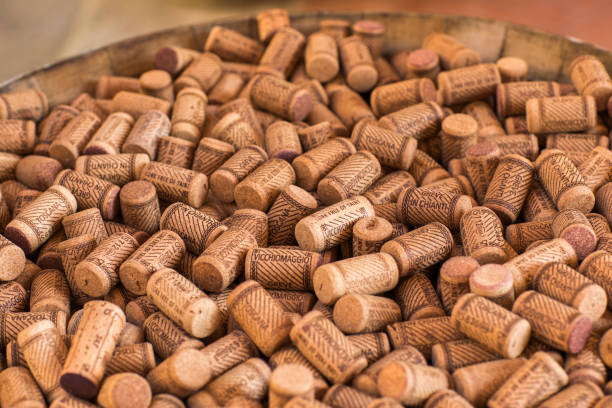 istock Background texture of a randomly scattered pile of assorted used wine corks with cultivar and winery details on the surface of the corks. 931142830