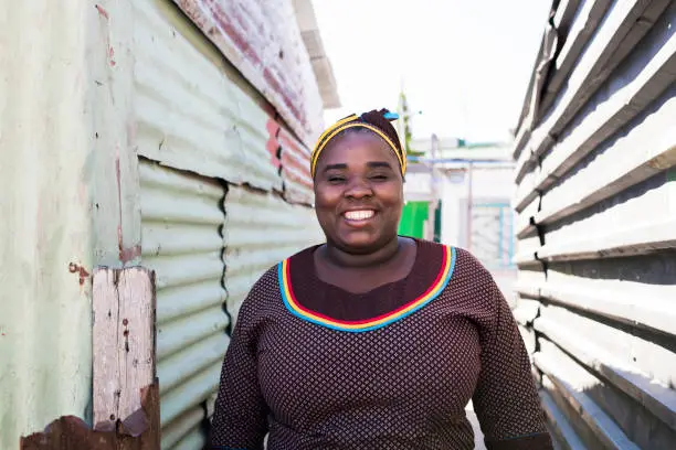 Portrait of a smiling mother standing outdoors