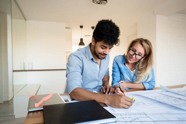 istock Businesspeople and architects planning 931144300