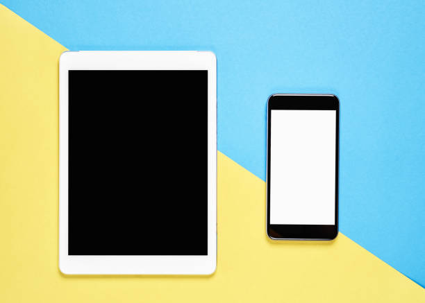istock Top view, Modern workplace with tablet placed on a pastel yellow background. Copy space suitable for use in graphics. 931144810