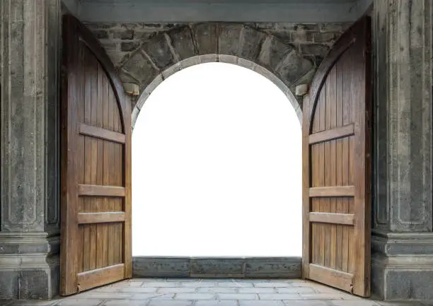 Photo of Large wooden door open in castle wall