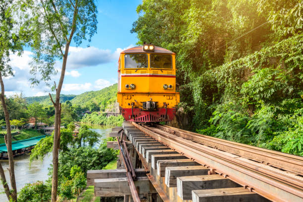 Ancient train running on wooden railway in Tham Krasae, Kanchanaburi, Thailand