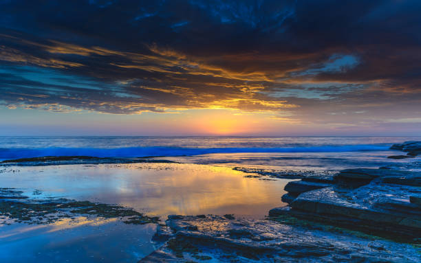 istock Blue Sunrise Seascape and Rock Platform 931165024