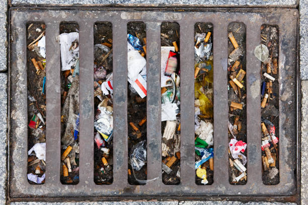Sewer full of garbage. Urban pollution. Waste treatment. Environmental stock photo