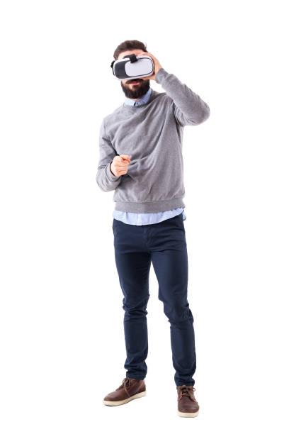 istock Young adult man holding virtual reality headset pointing finger at camera. 931169402