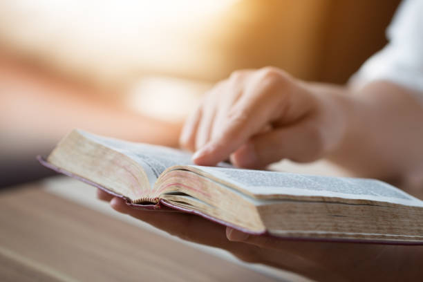 istock bible,women reading from the holy bible 931171558