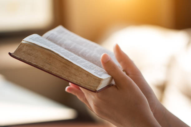 istock bible,women reading from the holy bible 931171592