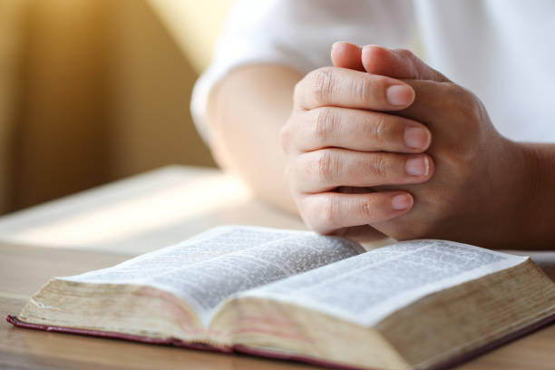 istock bible,women reading from the holy bible 931171626