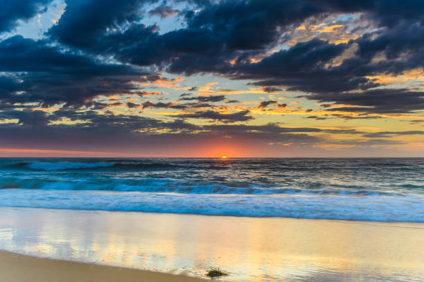 istock Sunrise Seascape at the Beach with Clouds 931173200