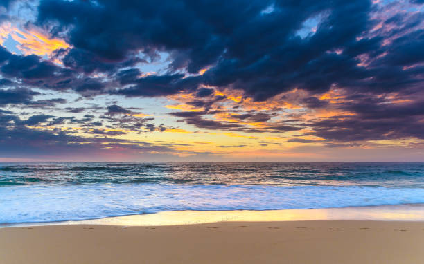 istock Sunrise Seascape at the Beach with Clouds 931173226