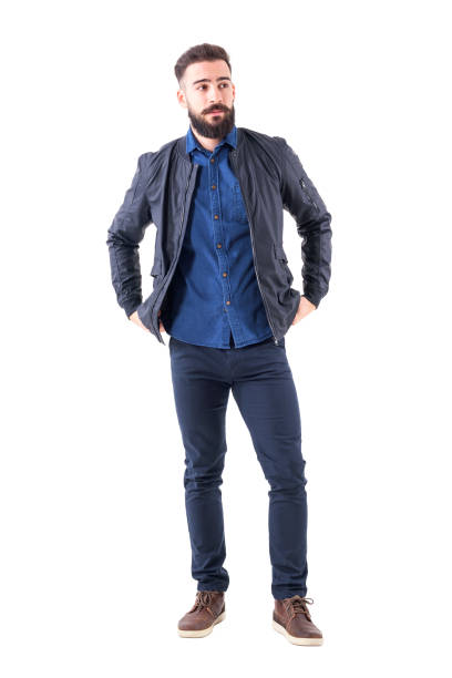 istock Bearded cool macho man adjusting bomber jacket and looking away 931173434