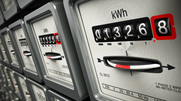 electric meters in a row standing on the wall - save costs imagens e fotografias de stock