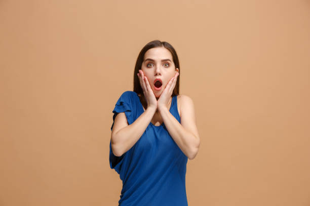 istock Beautiful woman looking suprised isolated on pastel 931173918