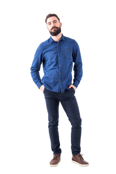 istock Cool smart casual young business man with cocked head looking at camera. 931174076