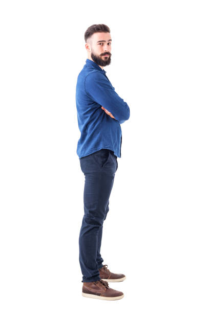 istock Side view of confident serious cool man with crossed arms looking at camera. 931174238