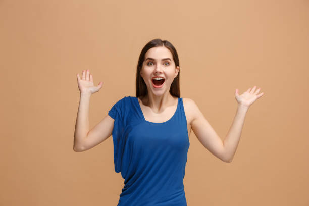 istock Winning success woman happy ecstatic celebrating being a winner. Dynamic energetic image of female model 931176398