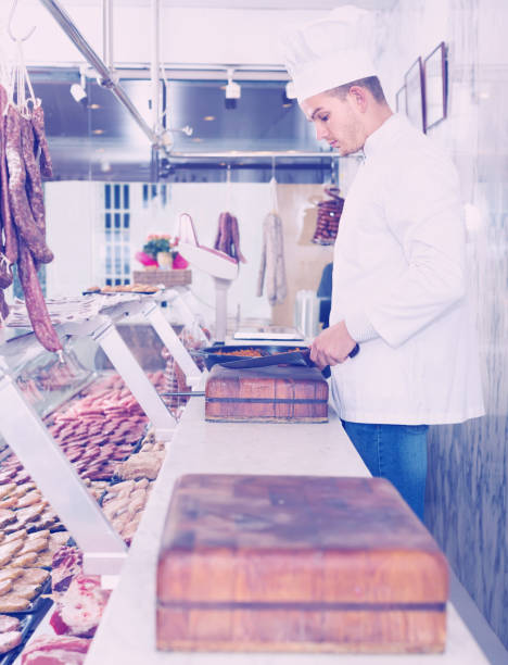 istock cheerful chief cooking fresh meat 931179190