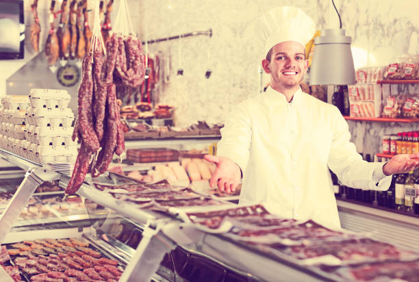 istock Young cook at butcher store 931179192