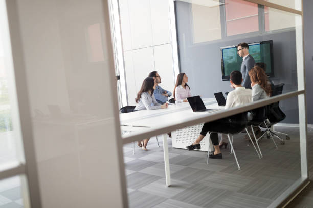 istock Group of business people collaborating in office 931179554
