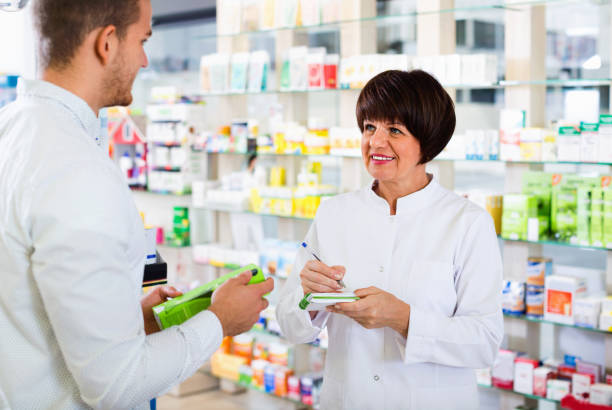 istock Smiling female pharmacist wearing uniform working 931179816
