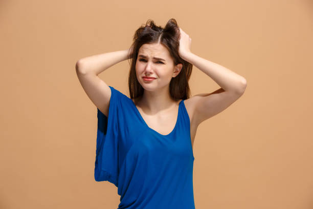istock Beautiful woman in stress isolated on pastel 931180332