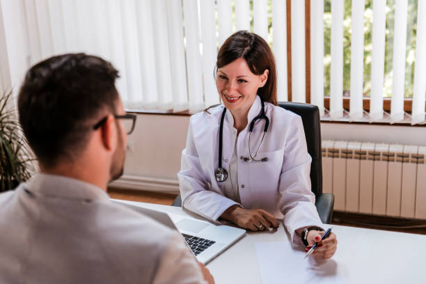 istock Young female doctor talking with businessman 931182822