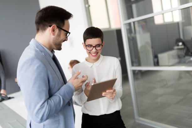 istock Happy business colleagues in modern office 931182948