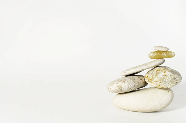istock Stones black and white pyramid on white background 931184074