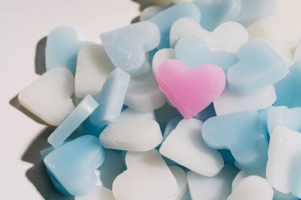 istock mini blue white and pink candle heart on white isolated background top view. 931184124