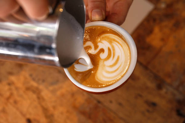 istock Creating latte art on long coffee with milk 931188912