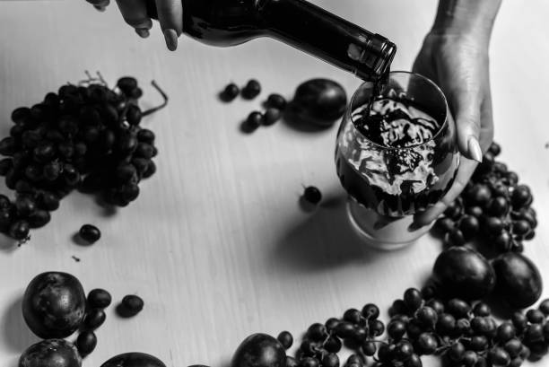 composition of wine, grape and plums black and white poster