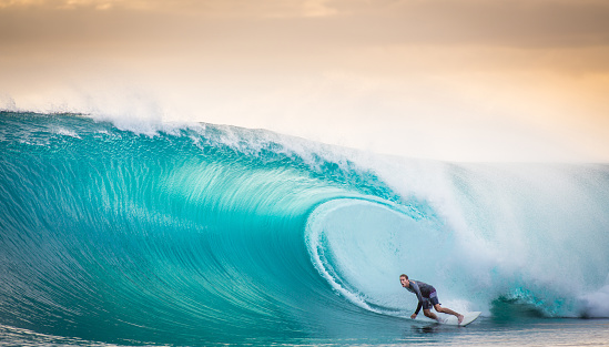 A surfer is in the barrel of a near perfect wave in the Mentawai islands of Indonesia. Photographed in August 28/2014