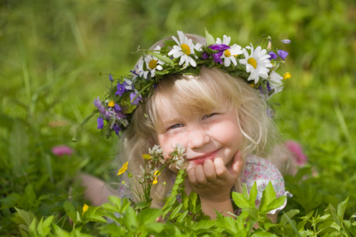 Portraits of a beautiful 4-year-old Argentine girl in a flower field- Buenos Aires - Argentina