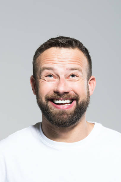 istock Headshot of excited bearded young man, grey background 931197706