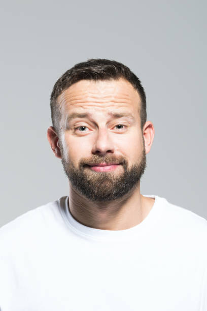 istock Headshot of cute bearded young man, grey background 931198148
