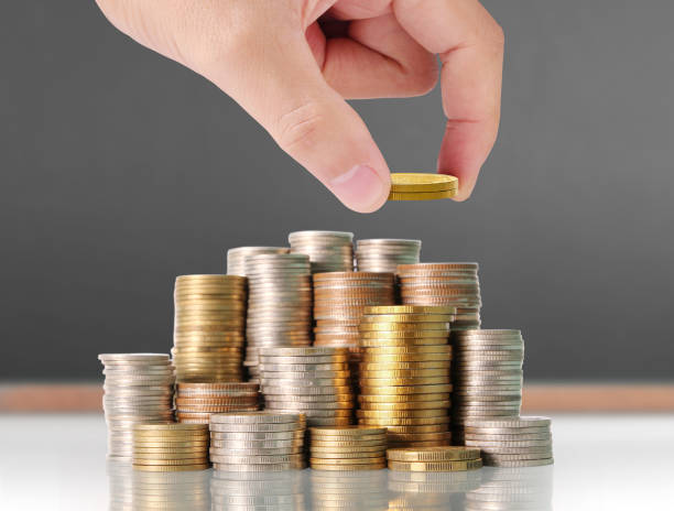 istock human hand putting coin to money 931198182