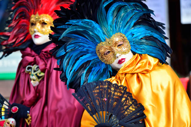 New Orleans, Louisiana in Mardi Gras Carnival Celebrations. Close-up of colorful Mardi Gras masks with intricate designs and decorations hanging in a shop, celebrating the vibrant culture of New Orleans