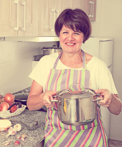 istock mature woman soup 931204318