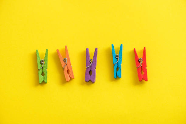 istock Pegs on the yellow background with copy space. 931208516