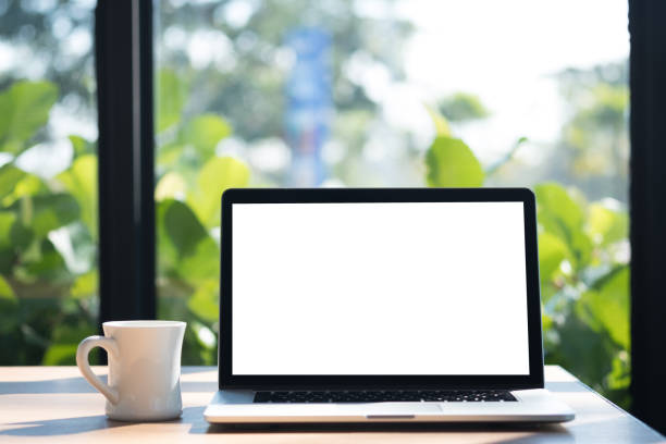 istock Laptop with blank screen on table. Workspace background new project on laptop computer with blank copy space screen for your advertising text message 931212644