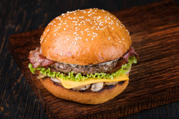 istock Burger on a wooden board 931216262