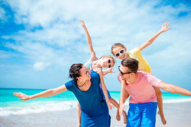 istock Happy family on beach vacation together 931217484