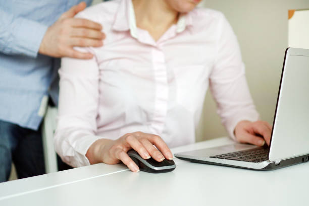 istock Sexual harassment at work. Man touching secretary's shoulder. 931224818