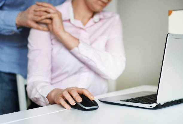 istock Sexual harassment at work. Man touching secretary's shoulder. 931224842
